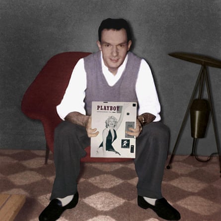 Playboy Magazine founder Hugh Hefner holding the first issue of Playboy featuring actress Marilyn Monroe.