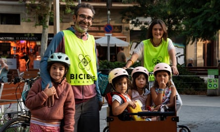 Iban Seguer and Rosa Suriñach in hi-vis jackets, with kids (from left) Marina, Lola, Jana.