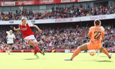 Arsenal’s Vivianne Miedema slots home the first of her two goals against Tottenham.