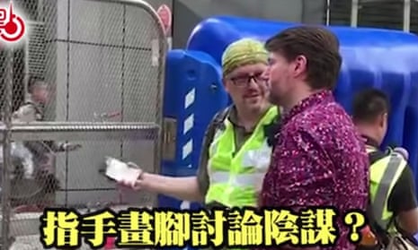 A screen grab of a social media post circulating in Hong Kong featuring a foreign worker. The caption says: “Gesticulating and discussing a plot?” China has been circulating images of foreigners, accusing them of stoking unrest in Hong Kong.