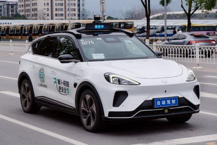 A robotaxi autonomous vehicle waits at a traffic light in Chongqing, China, February 15, 2025