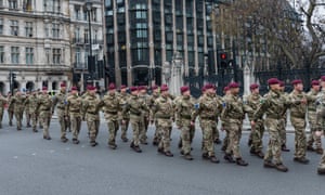 Members of British armed forces marched to Parliament. The government has announced a reorganisation of the army.