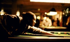 Teenage girl playing snooker.