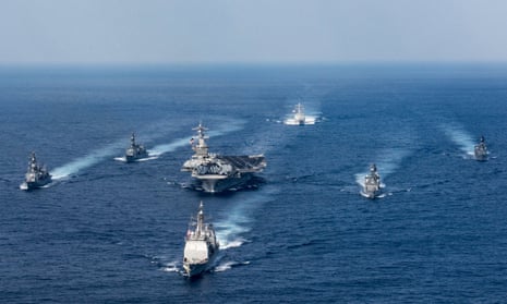 The US navy aircraft carrier USS Carl Vinson, the guided-missile destroyer USS Wayne E Meyer and the guided-missile cruiser USS Lake Champlain participate in an exercise with Japanese destroyers in March.