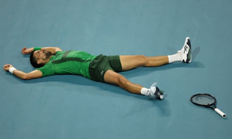Novak Djokovic lies on the court after losing a point against Jakub Menšík in the Miami Masters final.
