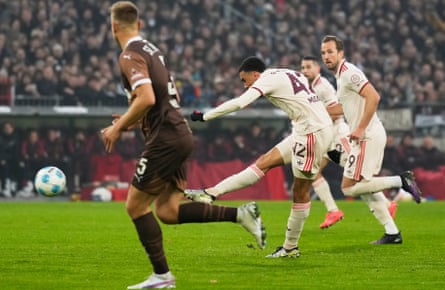 Jamal Musiala scores Bayern Munich’s winner at St Pauli, watched by Harry Kane.