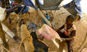 A 10-year-old boy manually ventilates a pit at a gold mine in Tindangou, a village in the east of Burkina Faso