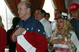 Dan Egeland and Hetty Hennessey, from Boulder, Colorado, stand with Republicans during the Pledge of Allegiance as they watch the inauguration of Donald Trump from a restaurant in Denver