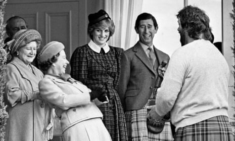The Queen, along with the Queen Mother, Prince Charles and Diana, Princess of Wales, meets strongman Geoff Capes at the Braemar Highland Games in September 1982.