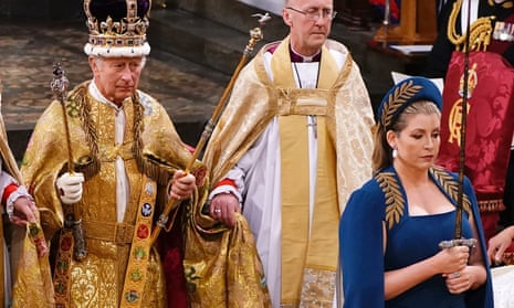 Penny Mordaunt catches the eye of many as she leads King Charles III during his coronation.