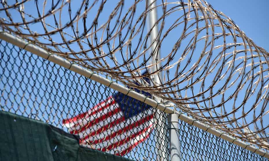 The razor wire-topped fence of Camp 6 detention facility at Guantánamo Bay, Cuba, seen in 2014.