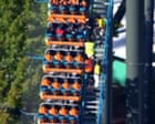 Aerial footage shows people rescued from rollercoaster after fatal incident at Six Flags – video