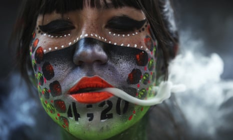 A protester smokes marijuana during a demonstration outside the national senate in Mexico City in April calling for the legalisation of marijuana.