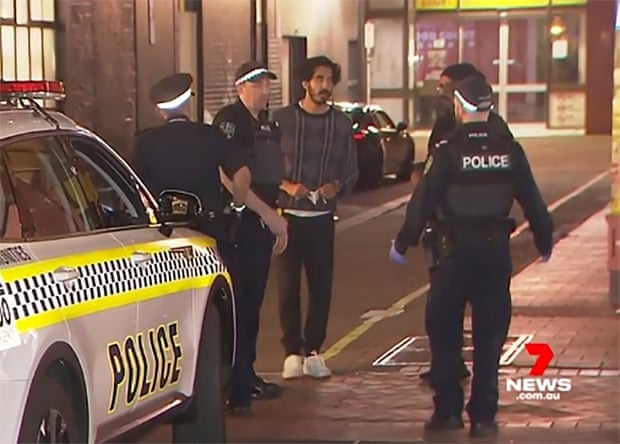 Dev Patel speaking to police