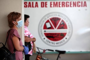 People wait outside the emergency room at the Medical Centre, in San Juan
