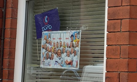 England poster and flag in window