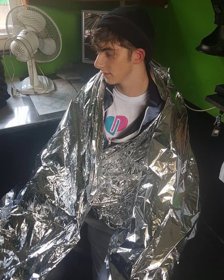 Nathan French, seen wearing more clothes and a space blanket after his treatment by a paramedic.