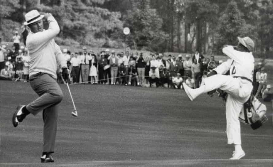 Jack Nicklaus and his Caddie Willie Peterson show their delight after a putt at the 1966 Masters.