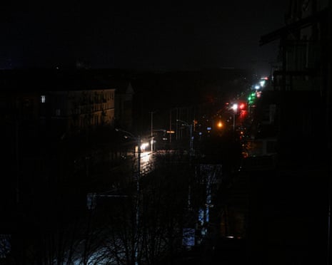 Cars move along a dark street during a power blackout after critical civil infrastructure was hit by today's Russian drone strikes, amid Russia's attack on Ukraine, in Zaporizhzhia, Ukraine.