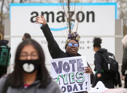 An Amazon Labour Union (ALU) organizer greets workers outside Amazon’s LDJ5 sortation center, as employees begin voting to unionize a second warehouse in the Staten Island borough of New York City.