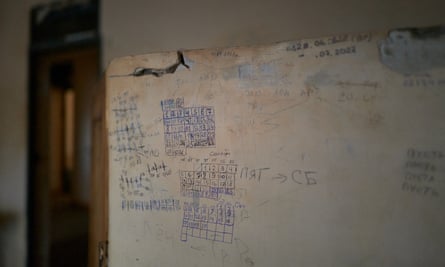 Dates marked on a wall in a cell where civilians were held and tortured by Russian troops in Kherson.