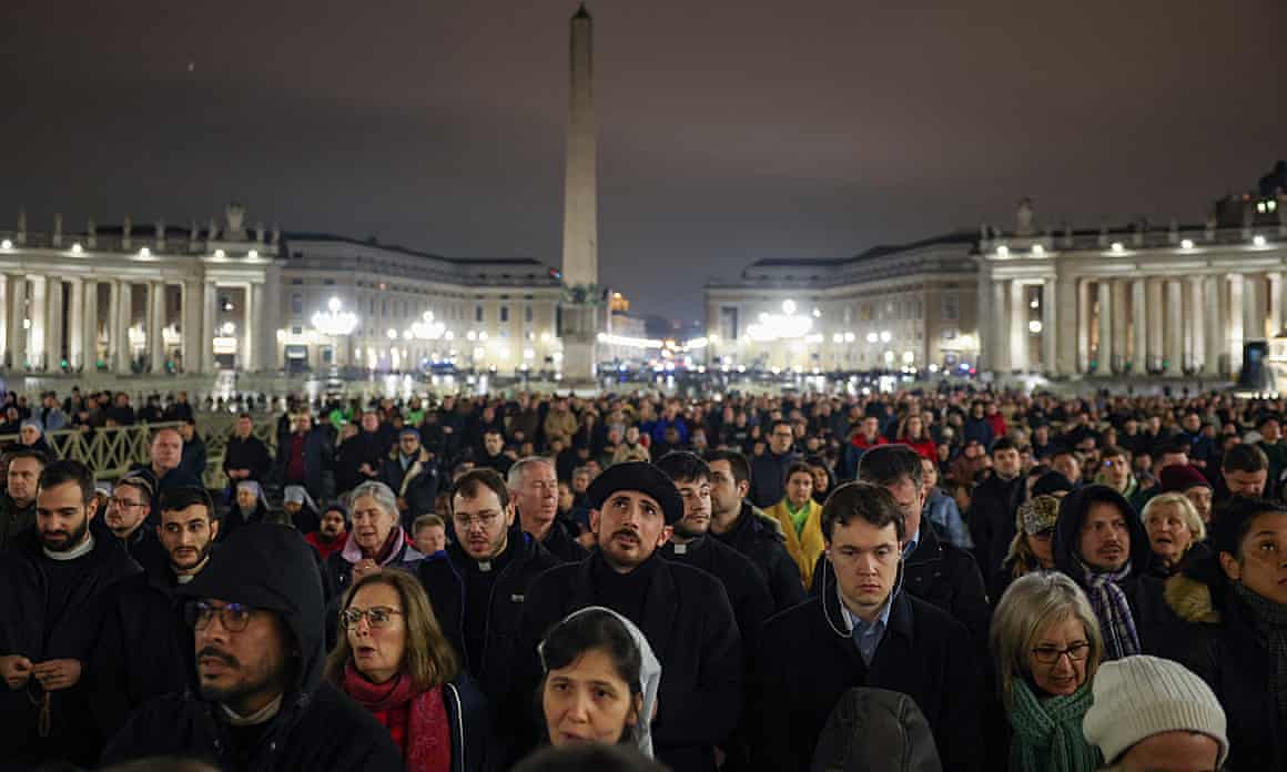 Crowds gather last night in St Peter’s Square, the Vatican, to pray for Pope Francis