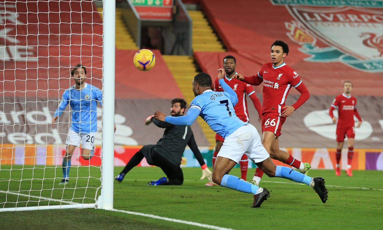Raheem Sterling scores Manchester City’s third goal against Liverpool at Anfield.