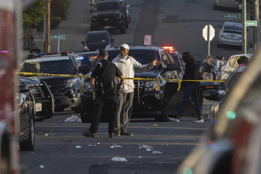 Officers at the scene of a shooting in Oakland where a 22-year-old man was killed.