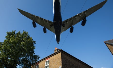 An aeroplane prepares to land at Heathrow airport.