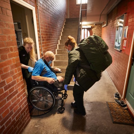 Brown and Nelson help take  Harvey to hospital after a fall.