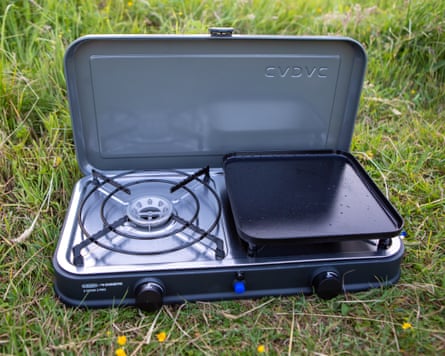 The Cadac Cook 2 Pro Deluxe QR Gas Stove and Grill on green grass