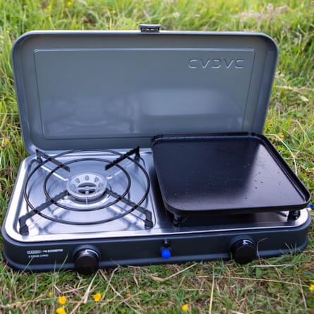 The Cadac Cook 2 Pro Deluxe QR Gas Stove and Grill on green grass