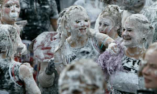 Freshers celebrate their initiation to St Andrew’s University with the traditional foam fight.