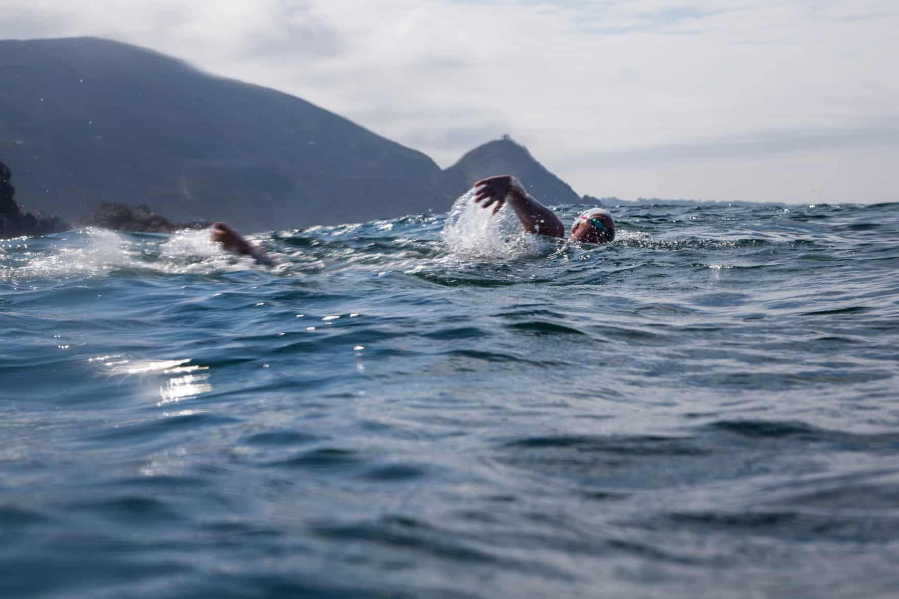 A woman swimming in the open ocean.