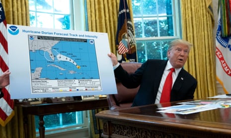 Donald Trump presents an official government weather map altered with a Sharpie to change the projected path of Hurricane Dorian.