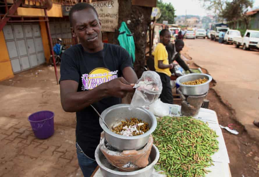 A street vendor cooks crickets