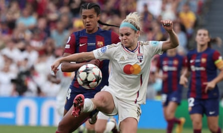Barcelona’s Esmee Brugts and Lyon defender Ellie Carpenter (in white) in action in the Women’s Champions League final in May.