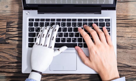 robot hand and man's hand on laptop keyboard