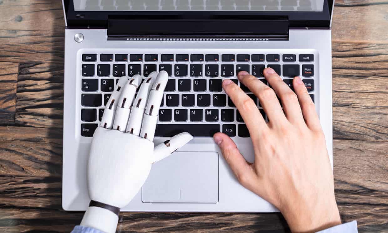 Man With Prosthetic Hand Working On Laptop
