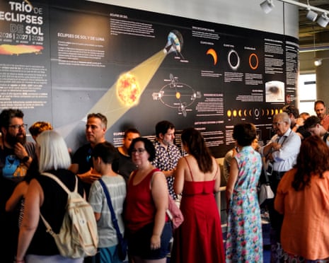 People queue in Madrid’s Planetarium as the city counts down to the solar eclipse in Madrid, Spain