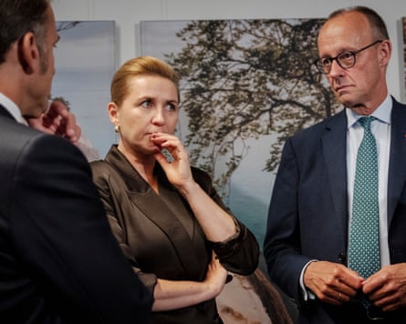 The Danish prime minister, Mette Frederiksen, talks to the German chancellor, Friedrich Merz, and the French president, Emmanuel Macron, on Thursday.