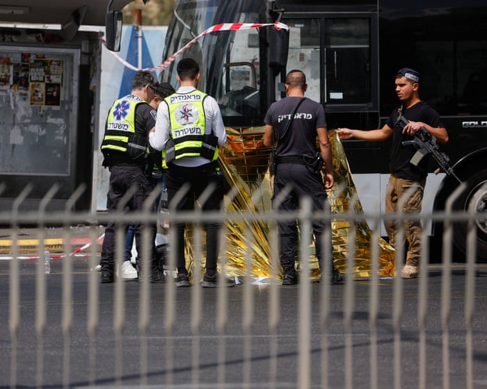 Palestinian gunmen kill six people at Jerusalem bus stop
