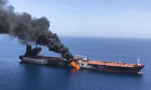 A burning oil tanker in the Gulf of Oman