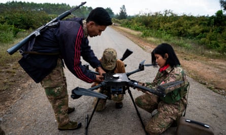 A squad of Myanmar rebels works to ready a drone for an attack on a nearby military base.