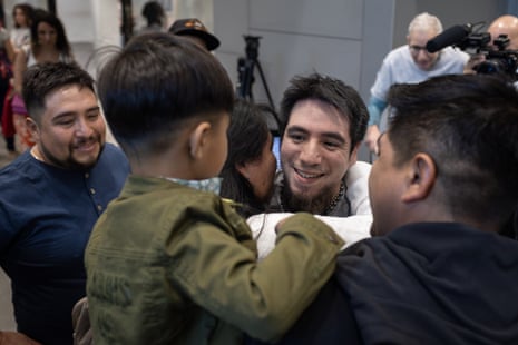 Ben Frutcher hugs his birth family on his arrival at Santiago airport, Chile