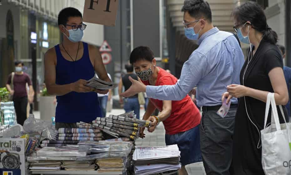 People queue up to buy Apple Daily on 18 June 2021.