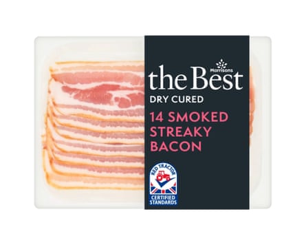 A packet of Morrisons The Best Dry Cured Smoked Streaky Bacon. There is a clear back and the rashers are clearly visible with a branded black label wrapped around the right side.