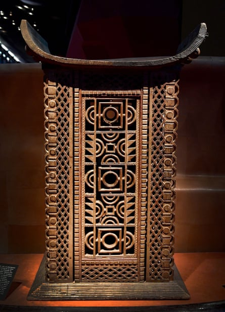 A throne made of carved wood and metal
