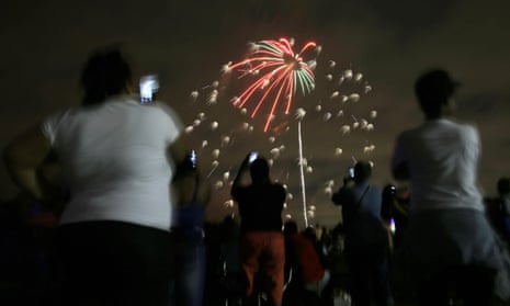 People watch a fireworks display in Newark, N.J., Tuesday, June 30, 2015.