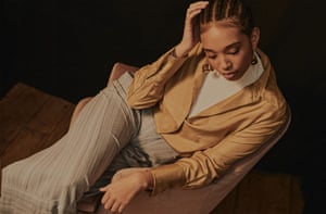 Ribbed roll neck, £275, by Wolford. Shirt, £295, by Joseph. Trousers, £1,395, by Roland Mouret. Earrings, £110, by Ariana Boussard-Reifel